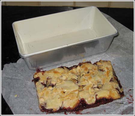 Small Batch Razz-Ma-Tazz raspberry bars baked in a 9x5 inch loaf pan.