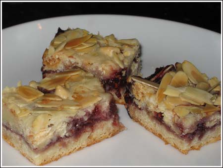 Razz-Ma-Tazz Bars  with melted white chips from a loaf pan.