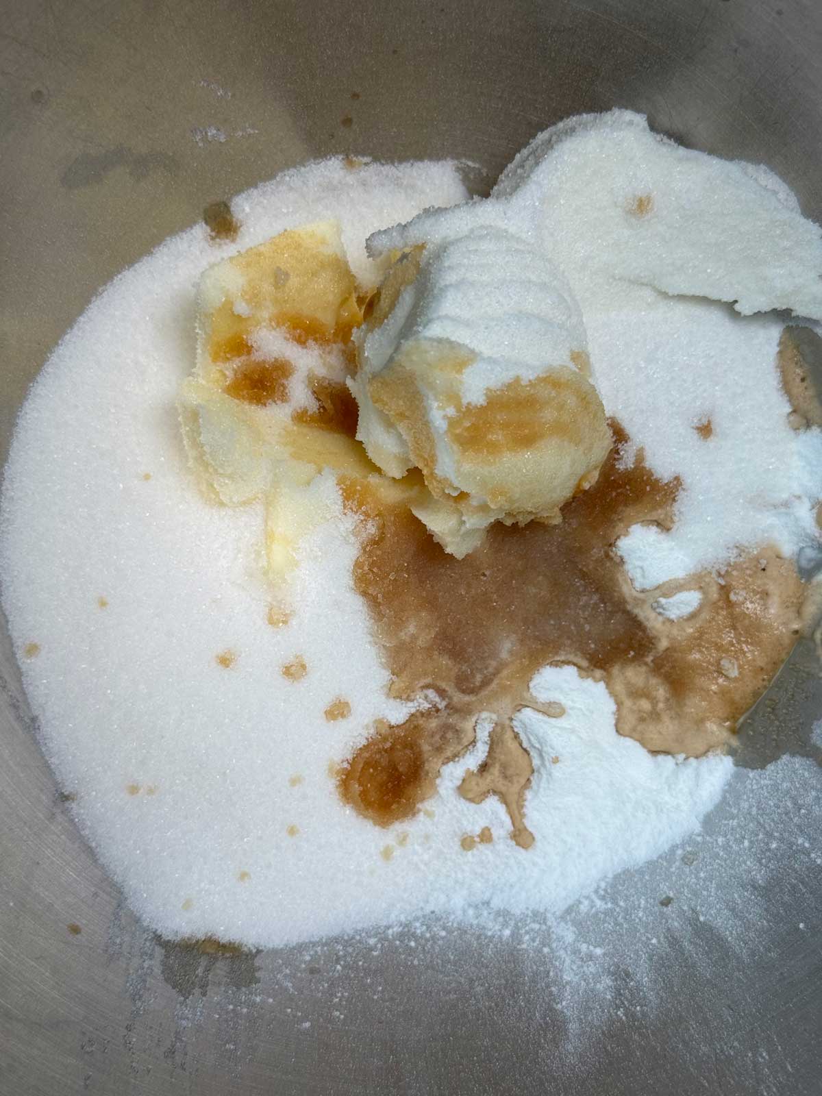 Sugar, shortening, vanilla and butter in the bowl of a stand mixer ready to be creamed for King Arthur Elegant White Cake.