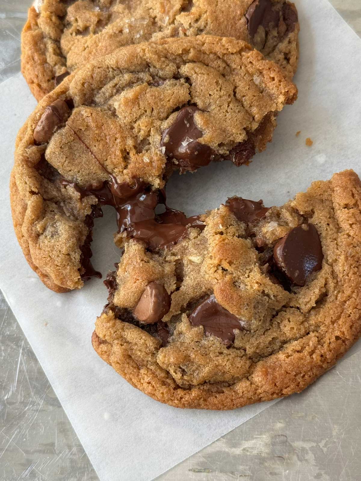 Chewy chocolate chip cookies made with shortening, malted milk powder and Hershey's Simply 5 chocolate syrup.