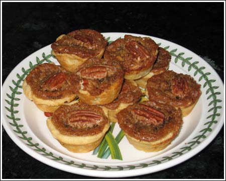 Pecan Tassies on a plate.