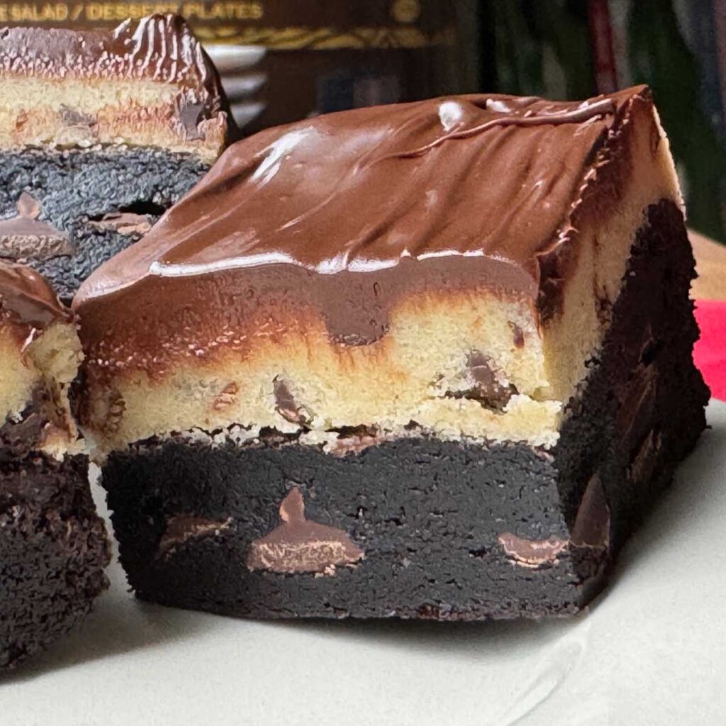 Chocolate Chip Cookie Dough Brownies stacked to show texture.