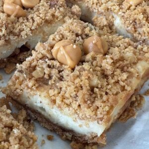 Butterscotch Cheesecake Squares or Bars made with graham cracker crumbs, nuts and butterscotch morsels.