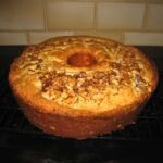 Junior League of Palo Alto Sour Cream Coffee Cake recipe baked in a tube pan.
