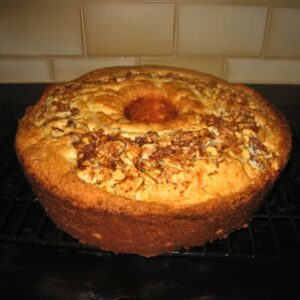 Junior League of Palo Alto Sour Cream Coffee Cake recipe baked in a tube pan.
