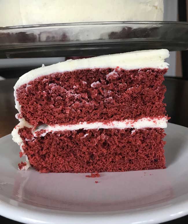 waldorf astoria red velvet cake slice on a plate.