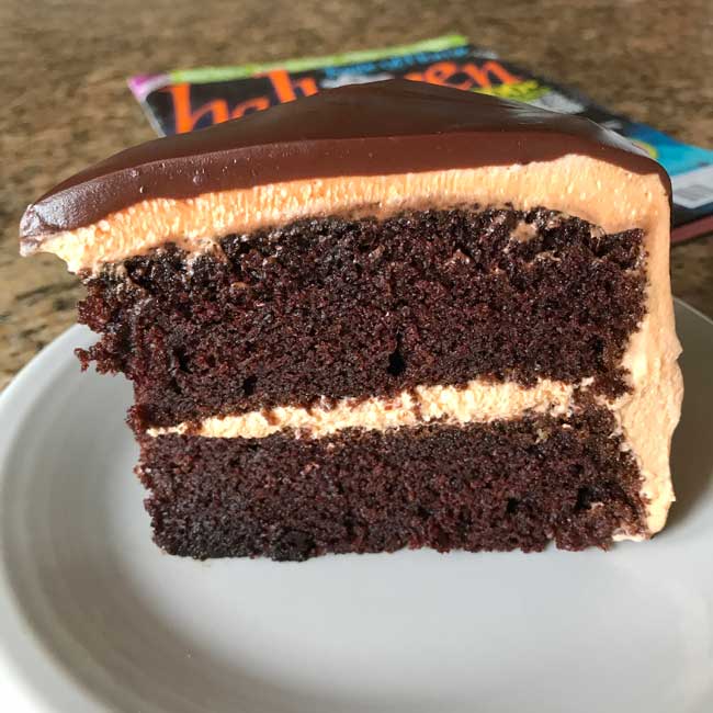 Slice of Halloween Tuxedo Cake on a plate