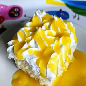 Coconut Sheet Cake with mango puree poured over the top.