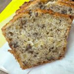 ropical Banana Bread from The Hill Country Reporter sliced to show moist texture and pecans.