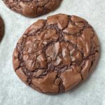 Soft and fudgy brownie cookies recipe with melted chocolate chips and cocoa powder.