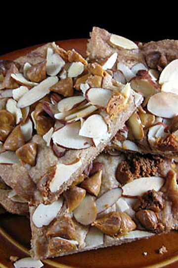 Almond Butterscotch Bars piled high on a plate to show what the recipe looks like.
