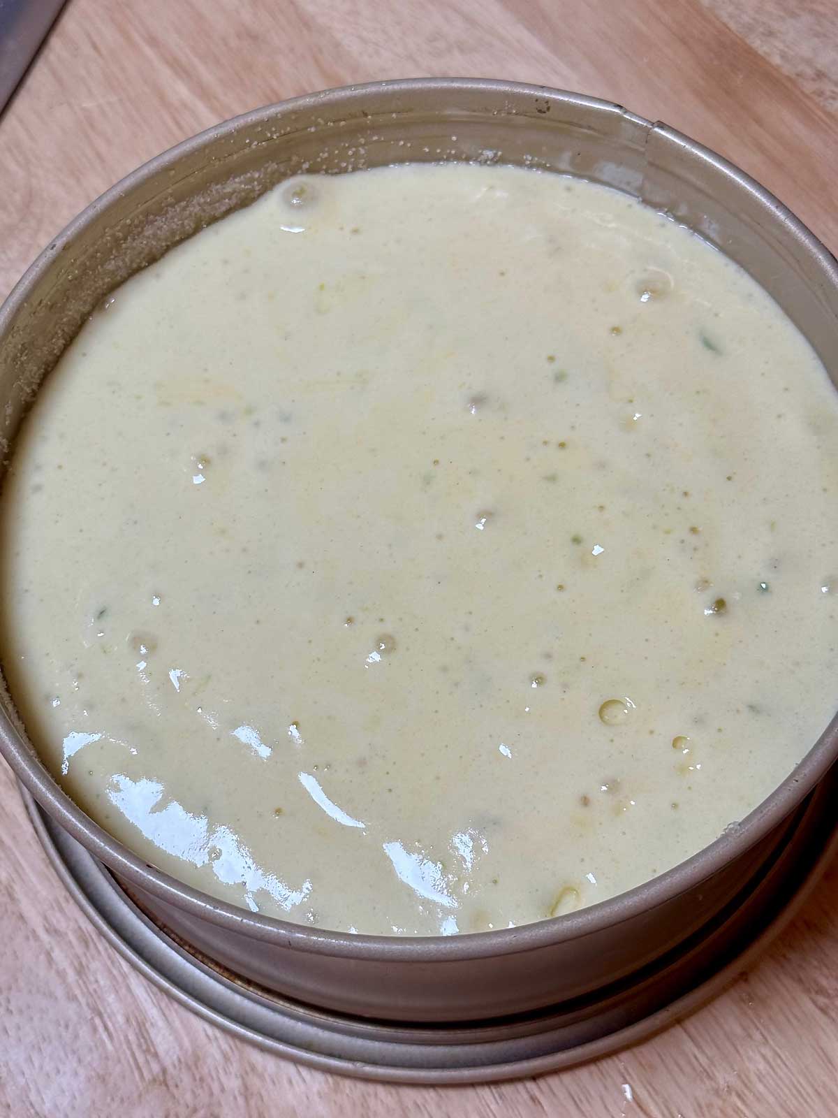 Sponge cake batter in a springform pan.