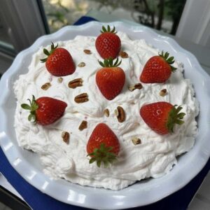 Ritz Cracker Pie with Strawberries in the whipped cream and whole berries on top.