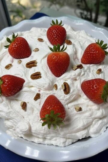Ritz Cracker Pie with Strawberries in the whipped cream and whole berries on top.