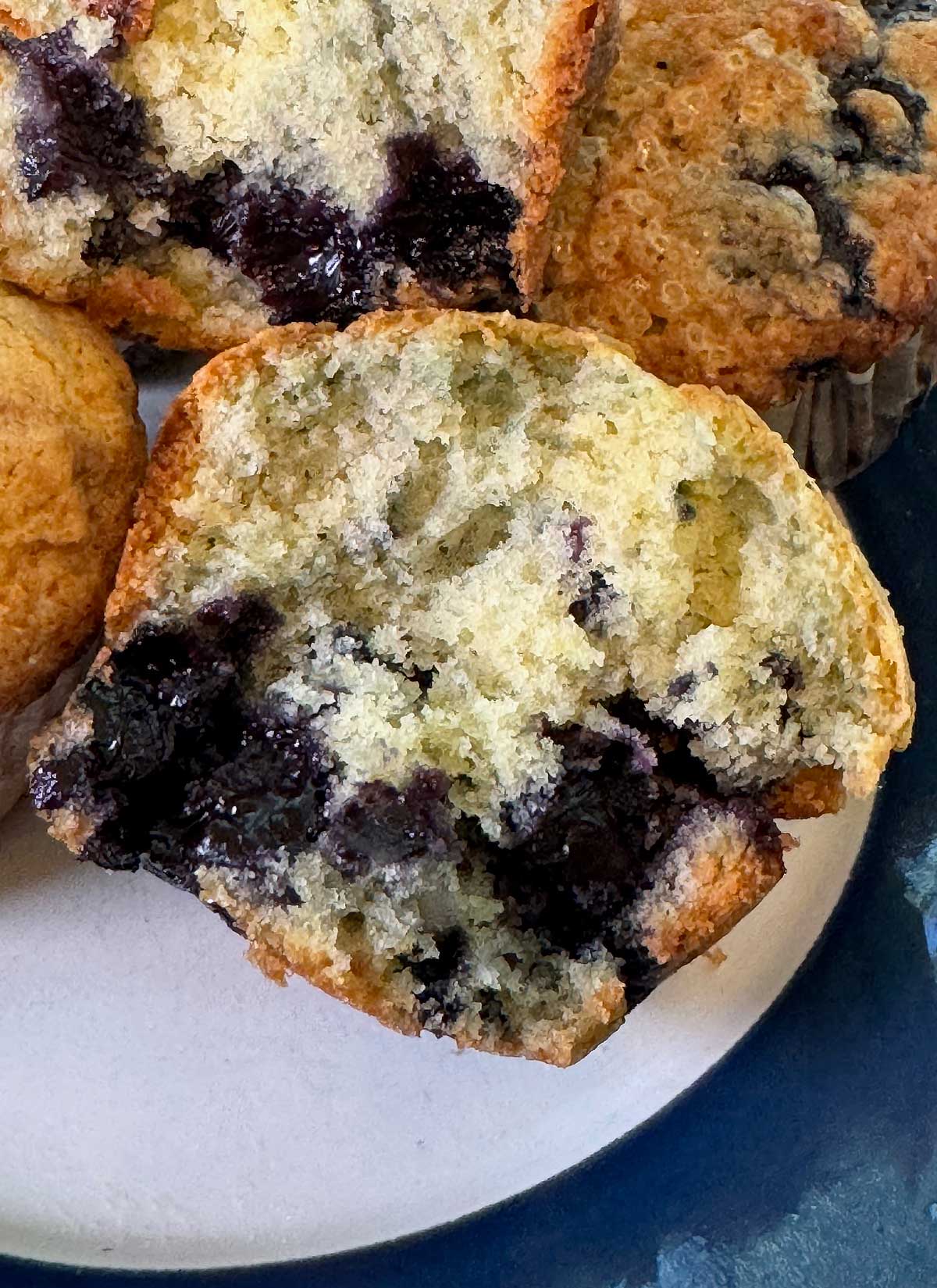 Split muffin showing texture of the Jordan Marsh blueberry muffin recipe.