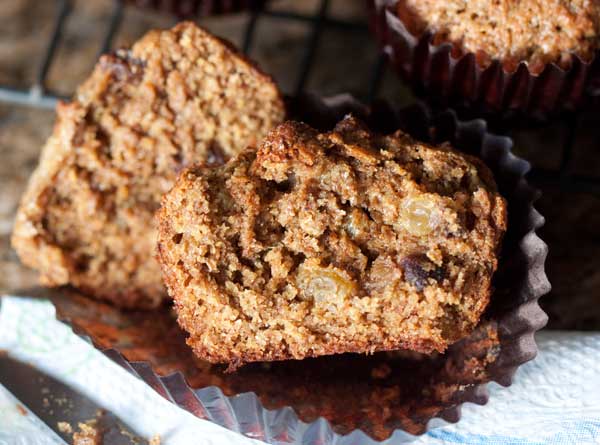 A bran muffin split to show moist interior.