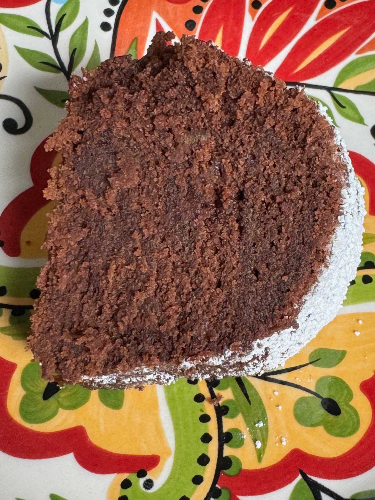 Slice of Maida Heatter's 86-Proof Chocolate Cake on a Bocca Espana plate.