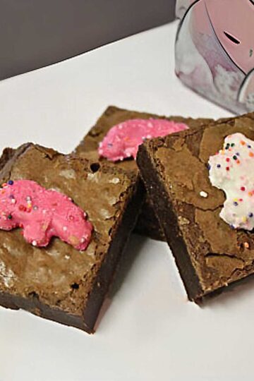 Circus Animal Brownies are fudgy brownies with shiny tops and Circus Animals on top.