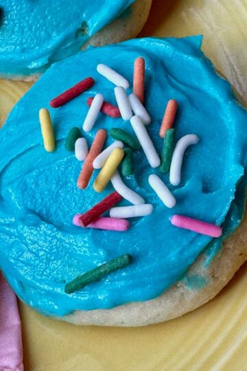 Amish Sugar Cookies with blue frosting and sprinkles.