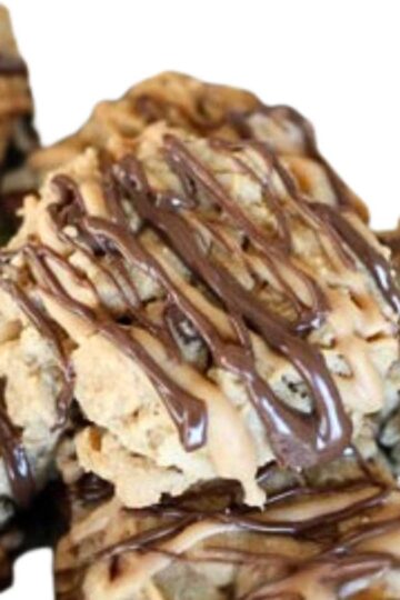 Double Striped Peanut Butter Cookies with a drizzle of melted chocolate chips and peanut butter chips.