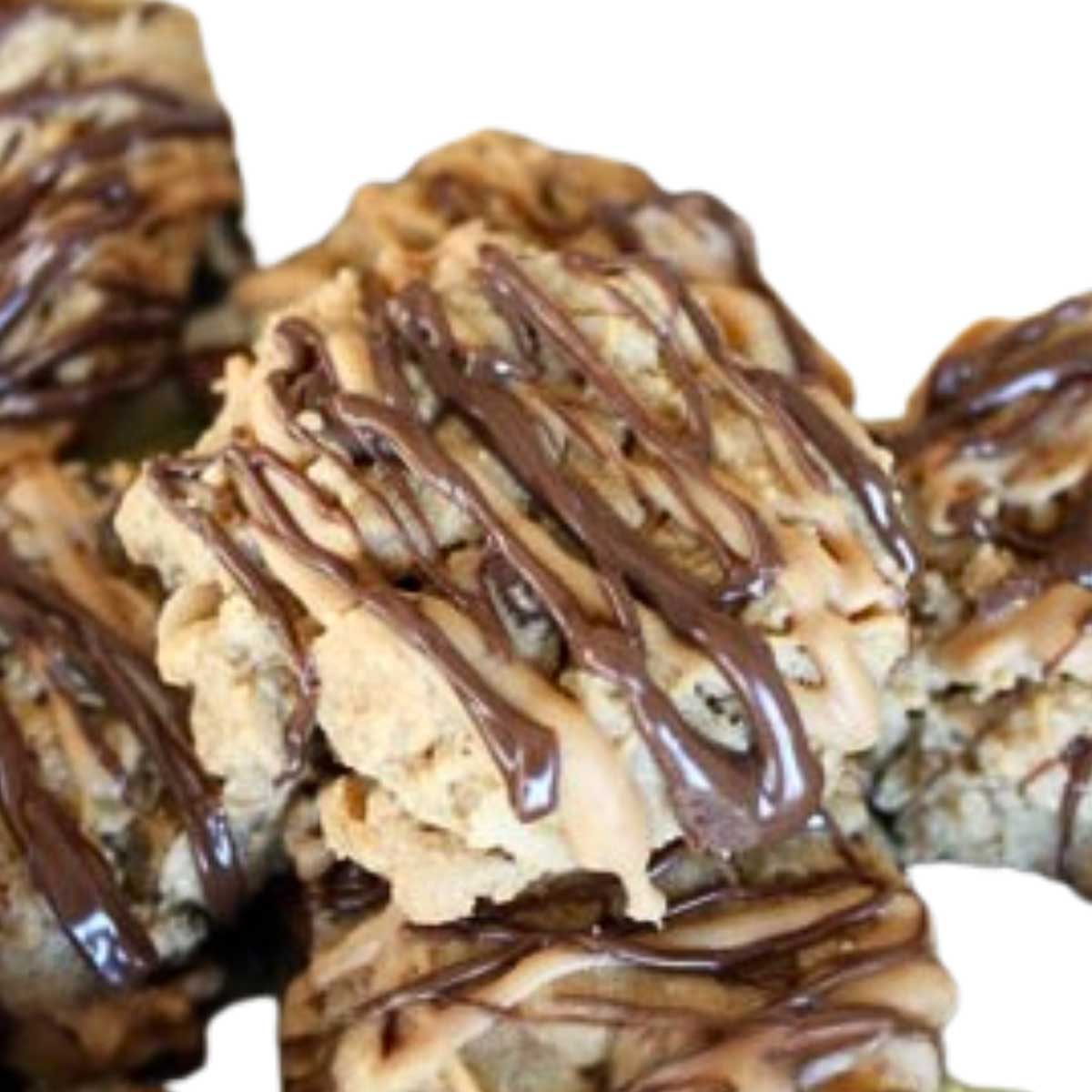Double Striped Peanut Butter Cookies with a drizzle of melted chocolate chips and peanut butter chips.
