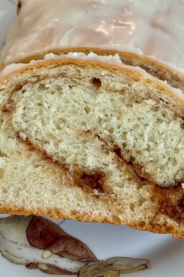 Slice of cinnamon swirl bread or cinnamon swirl loaves like the ones from school lunchrooms.