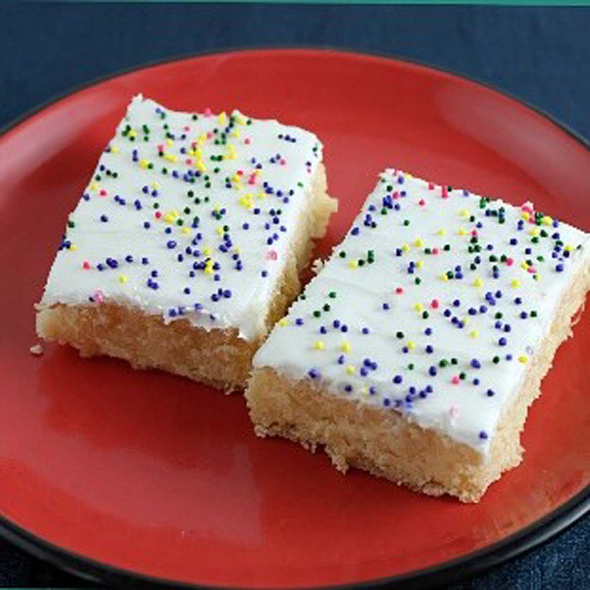 Mardi Gras Lemon Bars are frosted lemon blondies or brownies originally from the 1952 Pillsbury Bake-Off.