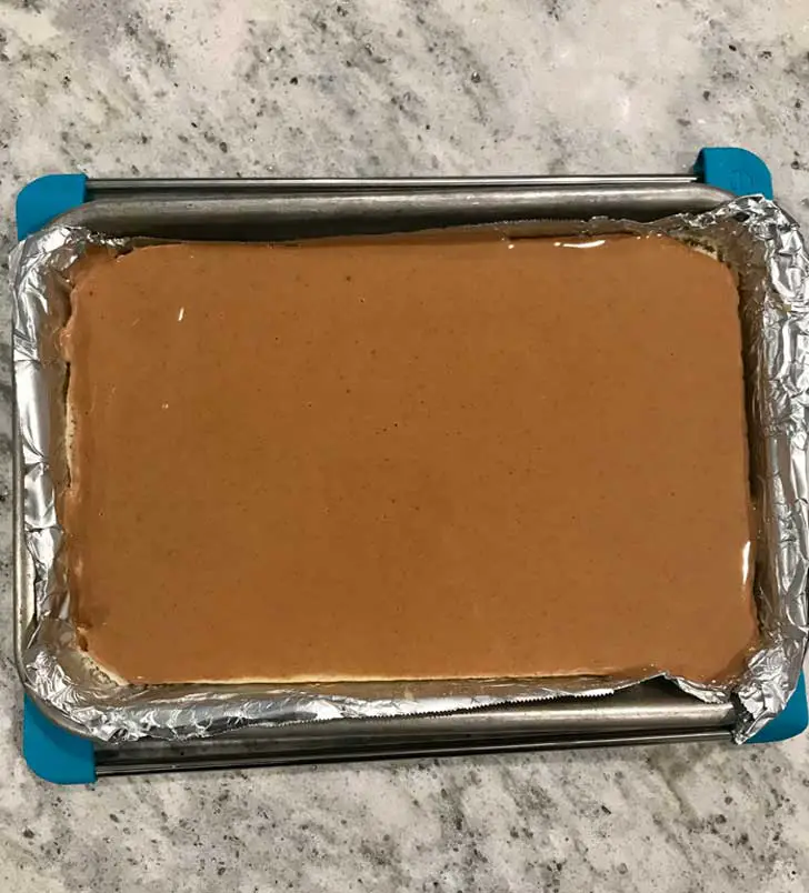 Layer of sponge cake topped with peanut butter