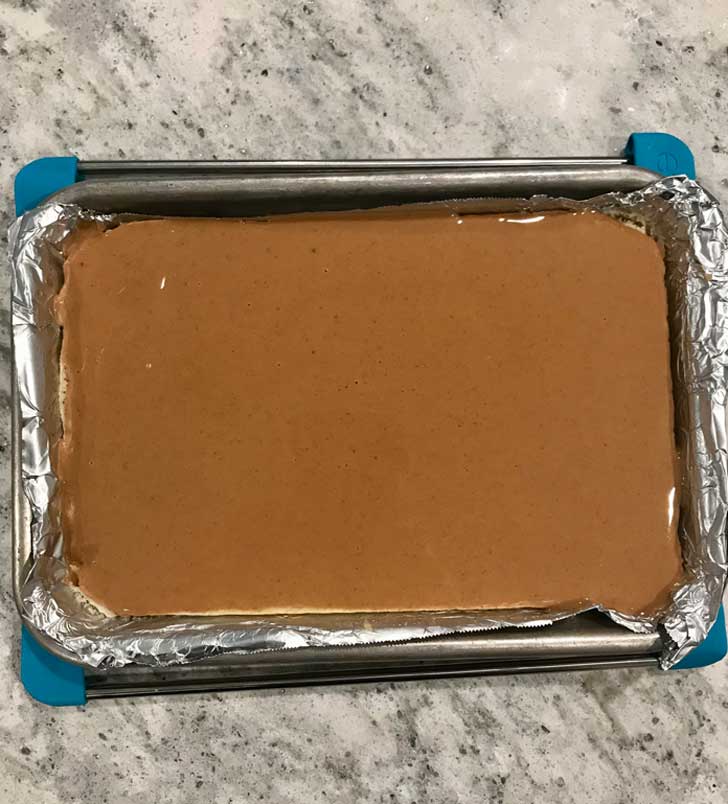 Layer of sponge cake topped with peanut butter