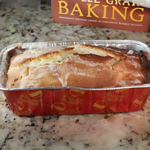 Recipe for a small vanilla pound cake made with whole wheat pastry flour and bread flour and a baked on glaze.