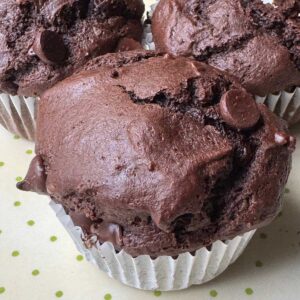Recipe for Chocolate Apple Butter Muffins with high crowns.
