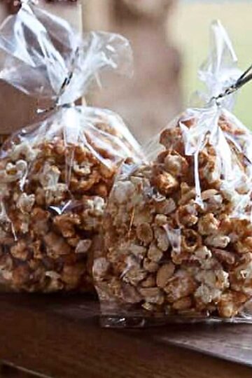 An easy traditional buttery holiday caramel corn recipe packed in individual clear bags.