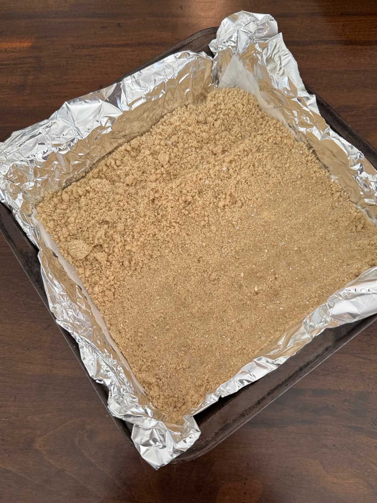 Alternative for when you are out of graham crackers, this Magic Cookie Bars crust is made of oat flour, flour, brown sugar and butter.