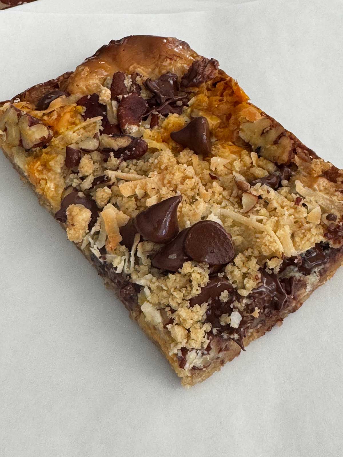 These Magic Cookie Bars also known as Seven Layer Bars have a crust made out of oats, flour, brown sugar, butter and salt.