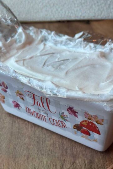 Ice cream sandwich cake being assembled in a mini loaf pan.