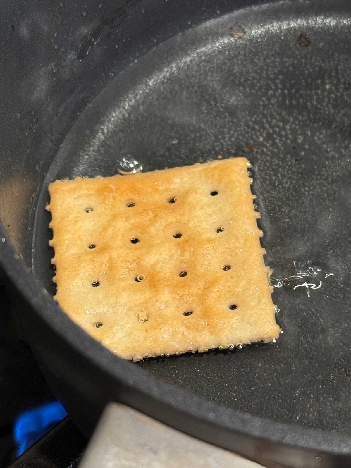 Saltine-Souffle-Crackers-2 Frying a Saltine cracker in sunflower oil.