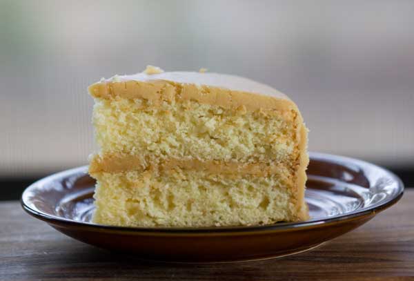 caramel-cake-slice Slice of Caramel Cake made with scratch yellow cake recipe.