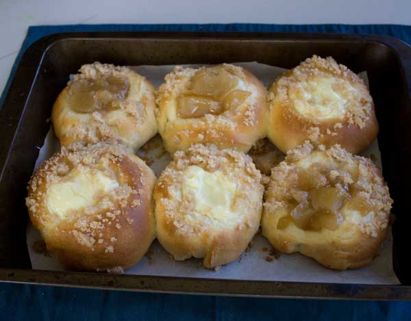 A pan of Potato Flakes Kolaches with cream cheese and apple fillings.