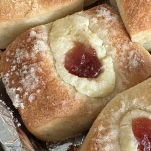 Authentic Texas style kolaches made with potato flakes, a cream cheese filling and preserves.