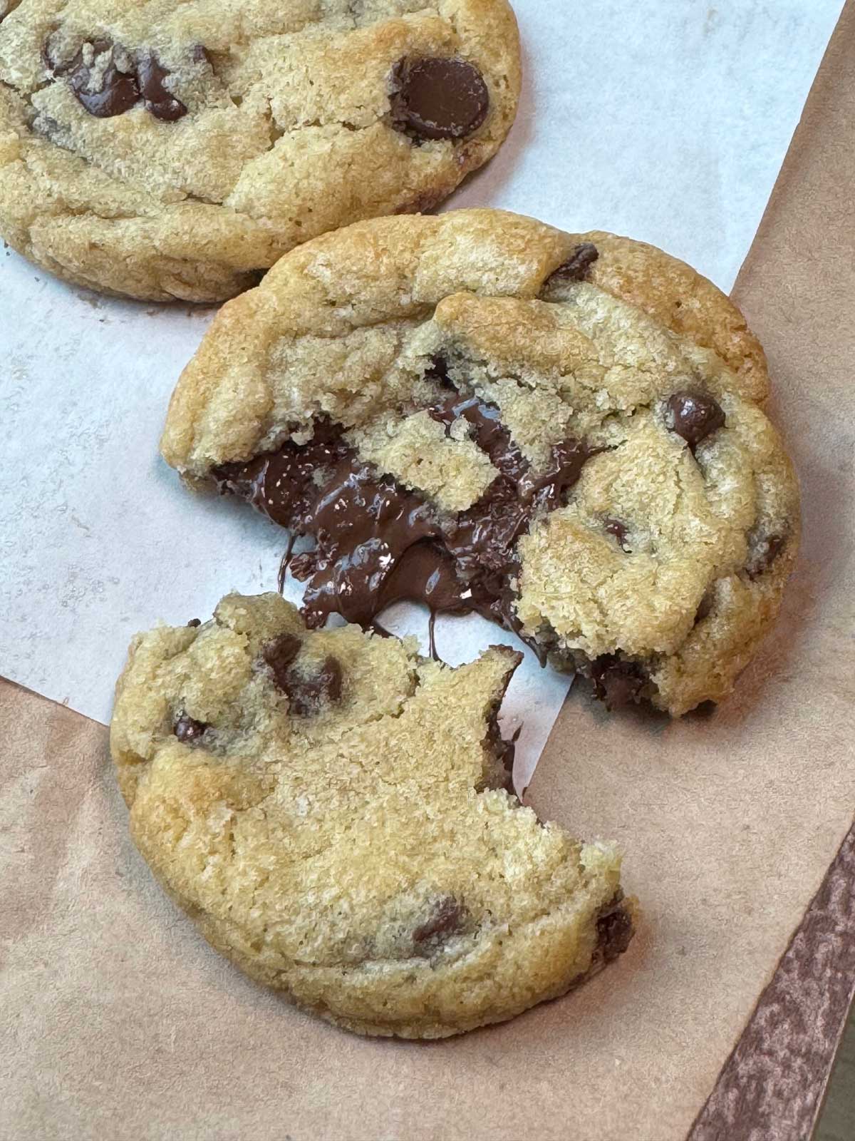 Best Big Chewy Chocolate Chip Cookies recipe with a broken cookie to show texture.