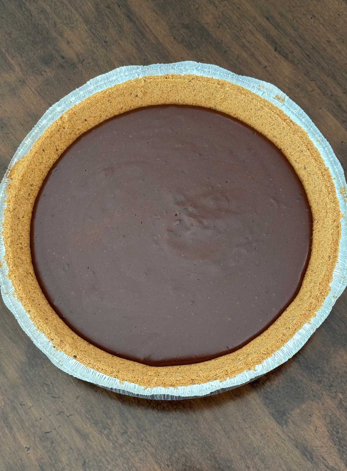 Evaporated milk chocolate pie filling in a store-bought graham cracker crust.