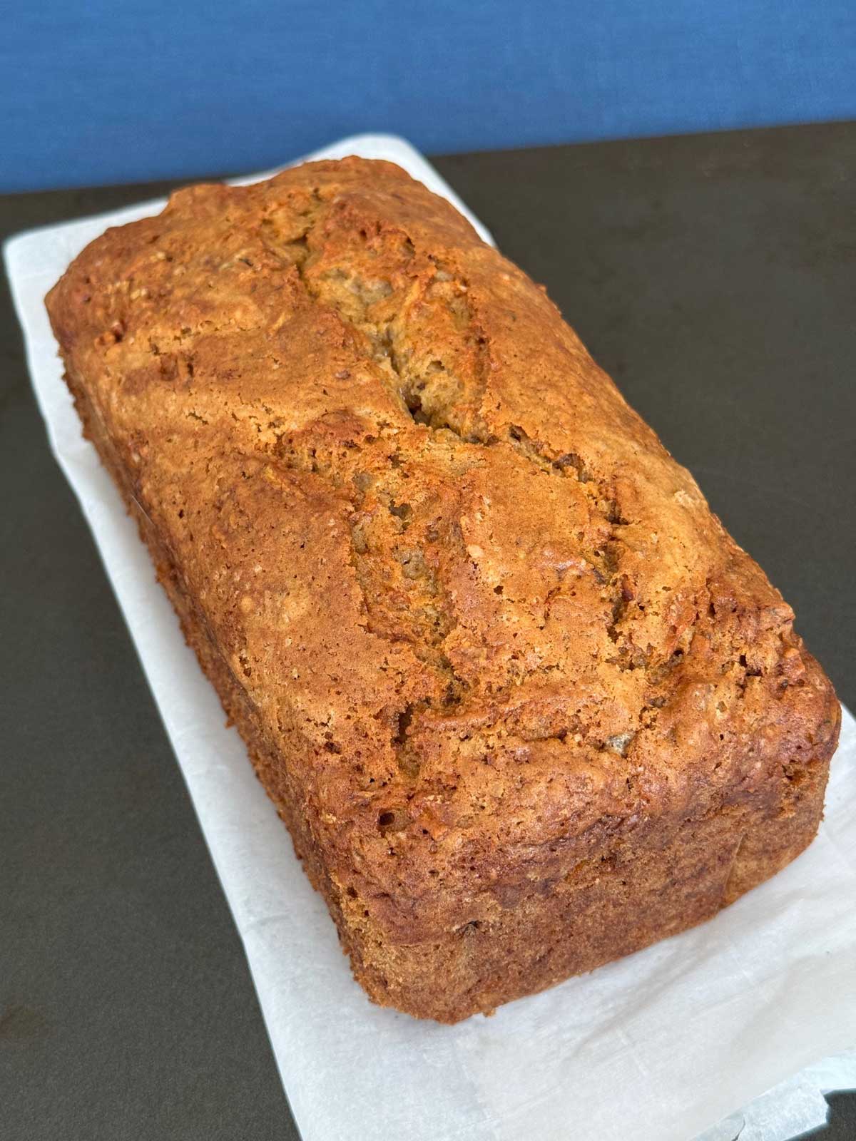 A loaf of sourdough zucchini bread made with sourdough discard, zucchini, carrots and apples.