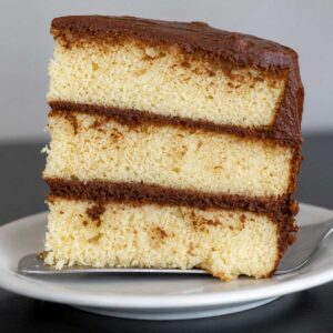 Slice of classic yellow cake from a recipe in the book Grandbaby Cakes Jocelyn Delk Adams.