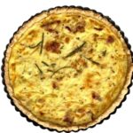 Classic Quiche Lorraine without onions or vegetables baked in a 9 inch removable bottom tart pan.