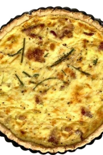 Classic Quiche Lorraine without onions or vegetables baked in a 9 inch removable bottom tart pan.