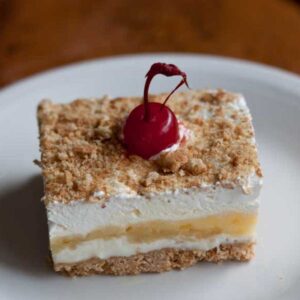 Slice of banana split cake based on a vintage recipe.