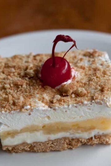 Slice of banana split cake based on a vintage recipe.