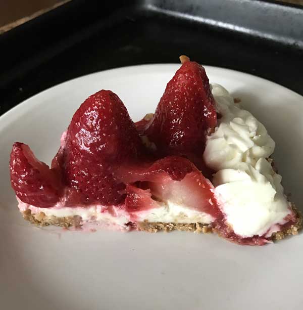 Strawberry-Almond Cream Tart sliced on a plate. Originally from Cooking Light.