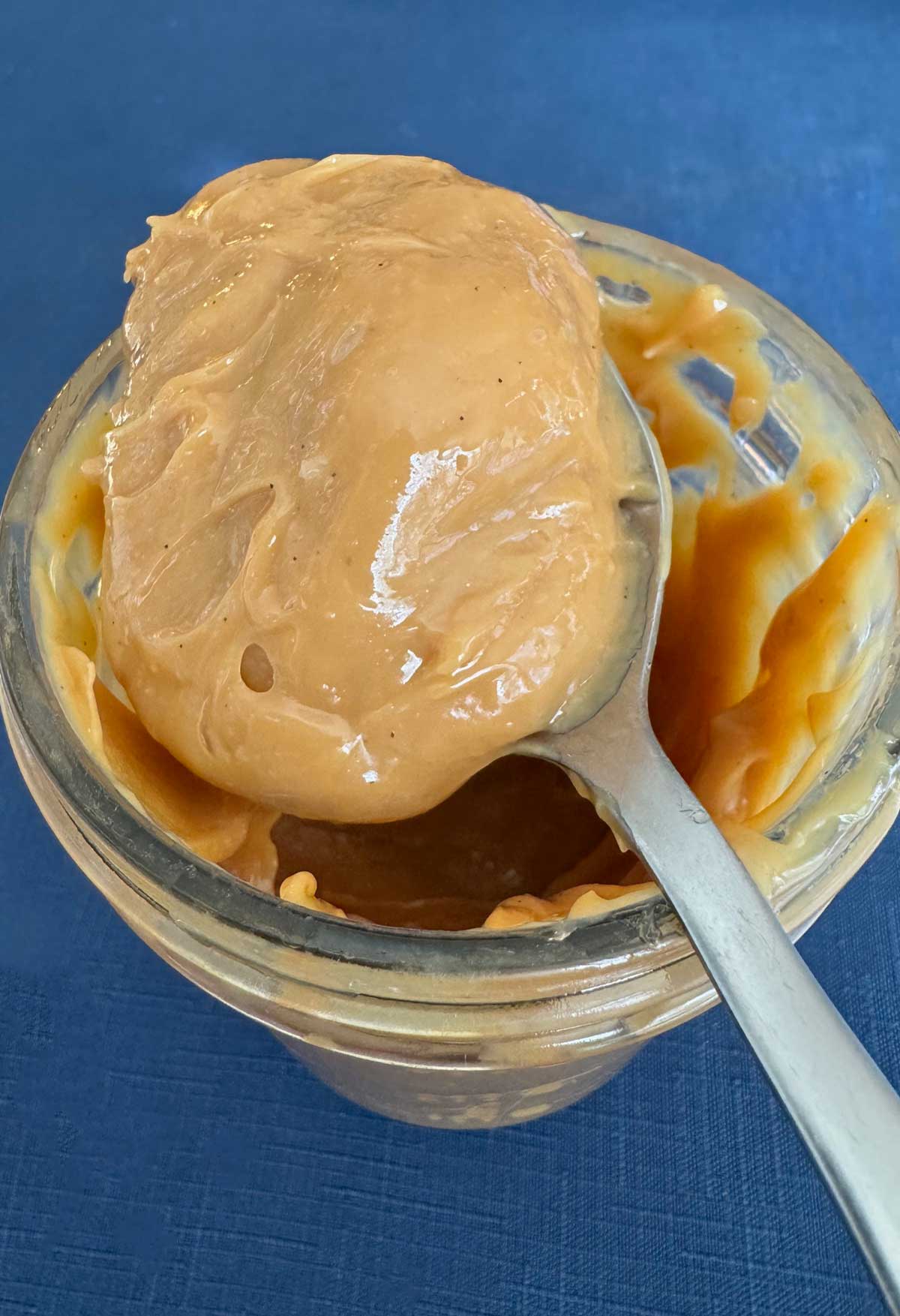 Instant Pot dulce de leche on a spoon.