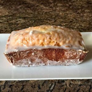 Glazed Adams Extract Pound cake made with the recipe on the back of the box.